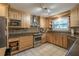 Well-lit kitchen featuring stainless steel appliances and granite countertops at 17735 Oak Bridge St, Tampa, FL 33647
