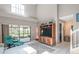 Cozy living room features a modern entertainment center and access to outdoor space at 17735 Oak Bridge St, Tampa, FL 33647