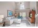 Open living room with high ceilings and sliders to the outdoor screened in lanai at 17735 Oak Bridge St, Tampa, FL 33647