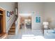Open-concept layout seamlessly connects the living room to the dining area and staircase at 17735 Oak Bridge St, Tampa, FL 33647