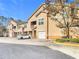 Exterior view of townhomes with parking, garages, and manicured landscaping at 17996 Villa Creek Dr # 17996, Tampa, FL 33647