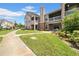 Exterior view of townhomes with well-maintained landscaping and walkways at 17996 Villa Creek Dr # 17996, Tampa, FL 33647