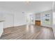 Open-concept living room featuring modern flooring, natural light, and backyard access at 17996 Villa Creek Dr # 17996, Tampa, FL 33647