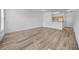 Inviting living room with wood-style flooring with view of the kitchen area at 17996 Villa Creek Dr # 17996, Tampa, FL 33647