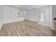 Bright living room with wood-look floors and door to outdoor living space; perfect for relaxing at 17996 Villa Creek Dr # 17996, Tampa, FL 33647