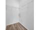 Walk-in closet features white walls, wood-look flooring and wire shelving at 17996 Villa Creek Dr # 17996, Tampa, FL 33647