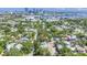 Aerial view showcases the home and the community with views of the downtown skyline at 1822 1St Se St, St Petersburg, FL 33705
