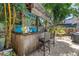 Outdoor bar with bamboo accents, seating, providing a perfect spot for entertaining at 1822 1St Se St, St Petersburg, FL 33705