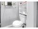 This bathroom has a toilet and storage shelves for organization at 1822 1St Se St, St Petersburg, FL 33705