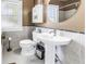 Full bathroom with pedestal sink, classic tilework, and vanity at 1822 1St Se St, St Petersburg, FL 33705