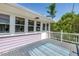 Relaxing deck view featuring the home's exterior with a side view of an outdoor retreat at 1822 1St Se St, St Petersburg, FL 33705