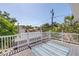 Outdoor deck with white railings and greenery, ideal for relaxing and enjoying the neighborhood views at 1822 1St Se St, St Petersburg, FL 33705