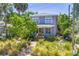 Charming two-story home with a purple exterior and well-manicured front yard at 1822 1St Se St, St Petersburg, FL 33705