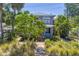 Charming two-story home with a purple exterior and well-manicured front yard at 1822 1St Se St, St Petersburg, FL 33705
