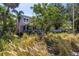 Landscaped front yard and charming two-story home nestled within lush surroundings at 1822 1St Se St, St Petersburg, FL 33705