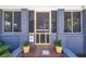 Charming home featuring a yellow screen door and planter boxes framing the entrance at 1822 1St Se St, St Petersburg, FL 33705