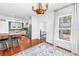 Open kitchen with island seating, stainless steel appliances, and hardwood floors at 1822 1St Se St, St Petersburg, FL 33705