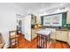 Traditional kitchen with white cabinetry, an island, and a farmhouse sink under a window at 1822 1St Se St, St Petersburg, FL 33705