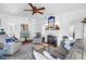 Spacious living room showcases a fireplace, comfortable seating, and a ceiling fan at 1822 1St Se St, St Petersburg, FL 33705