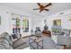 Cozy living room featuring a ceiling fan, French doors, and comfortable seating at 1822 1St Se St, St Petersburg, FL 33705