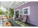 The covered patio shows comfortable lounge chairs with an outside view at 1822 1St Se St, St Petersburg, FL 33705