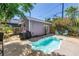 Backyard with pool, barbecue, and outdoor seating area perfect for relaxation and entertainment at 1822 1St Se St, St Petersburg, FL 33705