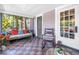 Charming screened porch features tile flooring, cozy seating, and plenty of natural light at 1822 1St Se St, St Petersburg, FL 33705