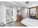 Bright studio apartment with french doors, murphy bed, and small kitchen area providing efficient, flexible living space at 1822 1St Se St, St Petersburg, FL 33705