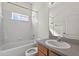 Bathroom featuring a tub, toilet, light gray countertop and cabinets at 1835 Fircrest Ct, Wesley Chapel, FL 33543