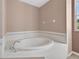 Corner view of soaking tub in Primary bathroom at 1835 Fircrest Ct, Wesley Chapel, FL 33543