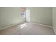 Bedroom with neutral carpet, light green walls, and one window at 1835 Fircrest Ct, Wesley Chapel, FL 33543