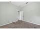 Bedroom featuring light green walls, carpet, and a door at 1835 Fircrest Ct, Wesley Chapel, FL 33543
