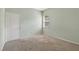 Bedroom features light green walls, carpet, and a window at 1835 Fircrest Ct, Wesley Chapel, FL 33543