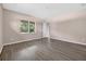 Bright bedroom featuring hard surface floors and large window views at 1835 Fircrest Ct, Wesley Chapel, FL 33543