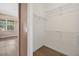 Walk-in closet features wire shelving with wood-look flooring at 1835 Fircrest Ct, Wesley Chapel, FL 33543