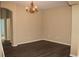 Inviting dining room with stylish chandelier and modern flooring at 1835 Fircrest Ct, Wesley Chapel, FL 33543
