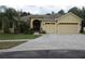 Charming one story home with a well-manicured lawn, two-car garage and neutral paint scheme at 1835 Fircrest Ct, Wesley Chapel, FL 33543