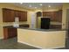 Spacious kitchen featuring plentiful cabinetry, granite countertops and modern appliances at 1835 Fircrest Ct, Wesley Chapel, FL 33543