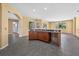 Open concept kitchen with breakfast bar and tile floors at 1835 Fircrest Ct, Wesley Chapel, FL 33543