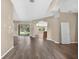 Bright living room with wood-look floors and open concept at 1835 Fircrest Ct, Wesley Chapel, FL 33543