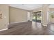 Living room with wood floors and sliding glass doors to backyard at 1835 Fircrest Ct, Wesley Chapel, FL 33543