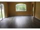 Bright living room with light-filled windows and contemporary flooring at 1835 Fircrest Ct, Wesley Chapel, FL 33543