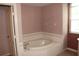 Relaxing bathroom featuring a separate tub at 1835 Fircrest Ct, Wesley Chapel, FL 33543