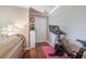 Entryway features Peloton bike, wooden floors, neutral walls, white door and white shelving unit at 18439 Bridle Club Dr # 18439, Tampa, FL 33647