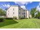 Multi-story apartment building with well-maintained lawn, green shrubbery, and inviting outdoor spaces at 18439 Bridle Club Dr # 18439, Tampa, FL 33647