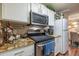 Well-equipped kitchen with stainless steel appliances, granite counters, and ample cabinet space at 18439 Bridle Club Dr # 18439, Tampa, FL 33647