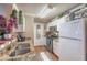 Updated kitchen features white cabinets, granite countertops, stainless steel appliances, and wood flooring at 18439 Bridle Club Dr # 18439, Tampa, FL 33647