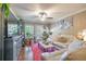 Inviting living room with a large TV, shelving unit, ceiling fan, and comfortable seating at 18439 Bridle Club Dr # 18439, Tampa, FL 33647