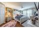 Stylishly decorated main bedroom with wood floors, ample natural light, and decorative accents at 18439 Bridle Club Dr # 18439, Tampa, FL 33647