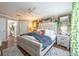Charming main bedroom with wood floors, complemented by warm lighting and decorative details at 18439 Bridle Club Dr # 18439, Tampa, FL 33647